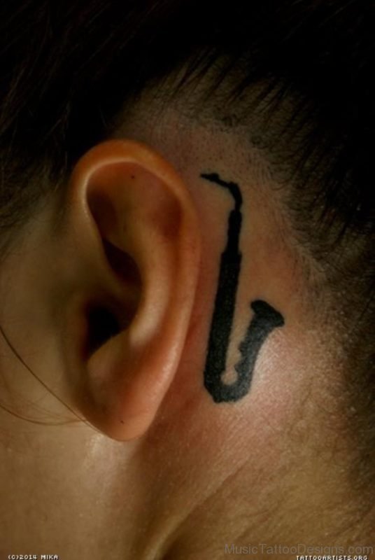 Saxophone Tattoo On Behind Ear