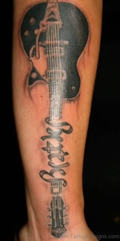 Famous Beatles Text And Band Guitar Tattoo On Leg