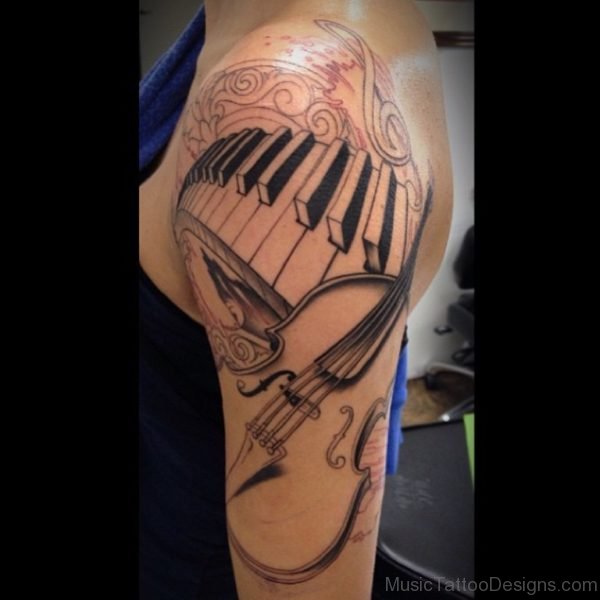 Hot Women Half Sleeve Awful Piano Keys With Guitar Tattoo