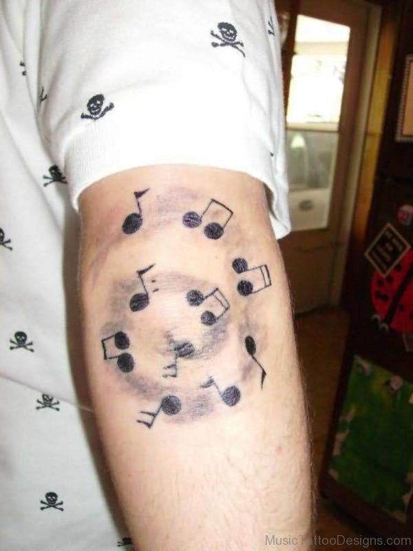 Music Notes Tattoo On Elbow