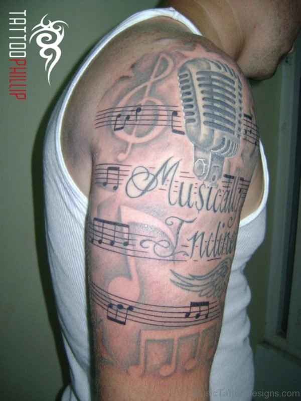 Music Notes Tattoo On Half Sleeve