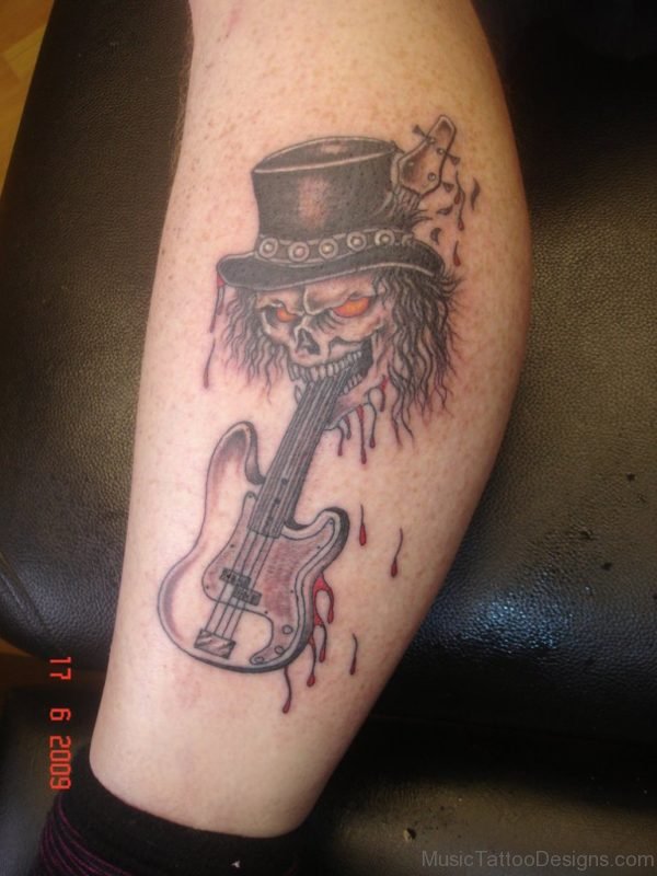 Red Eyes Skull And Guitar Tattoo On Leg